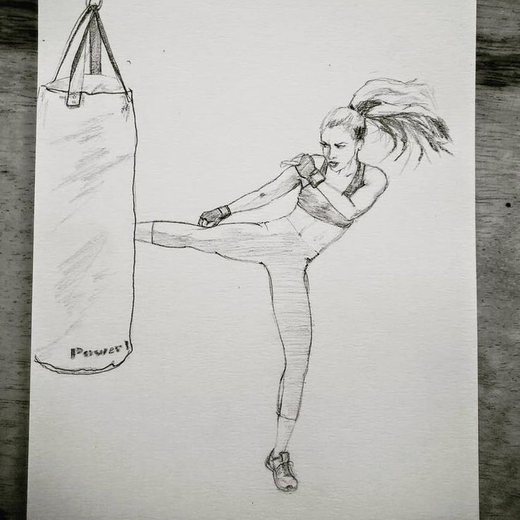 a pencil drawing of a woman kicking a punching bag with her leg in the air