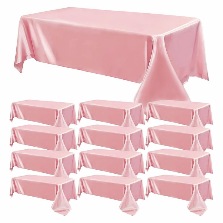 pink tablecloths and chairs are arranged in rows