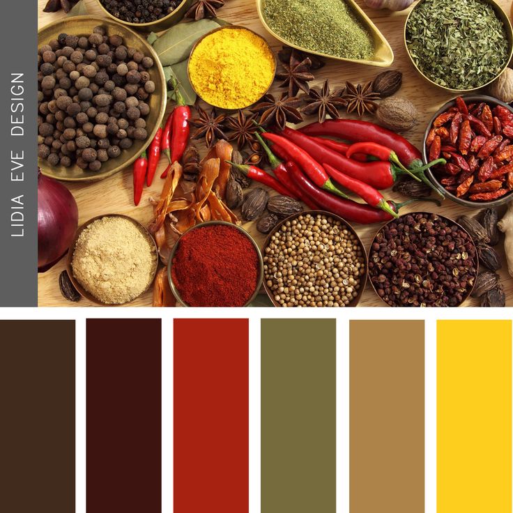 an assortment of spices and seasonings in bowls on a wooden table with color swatches