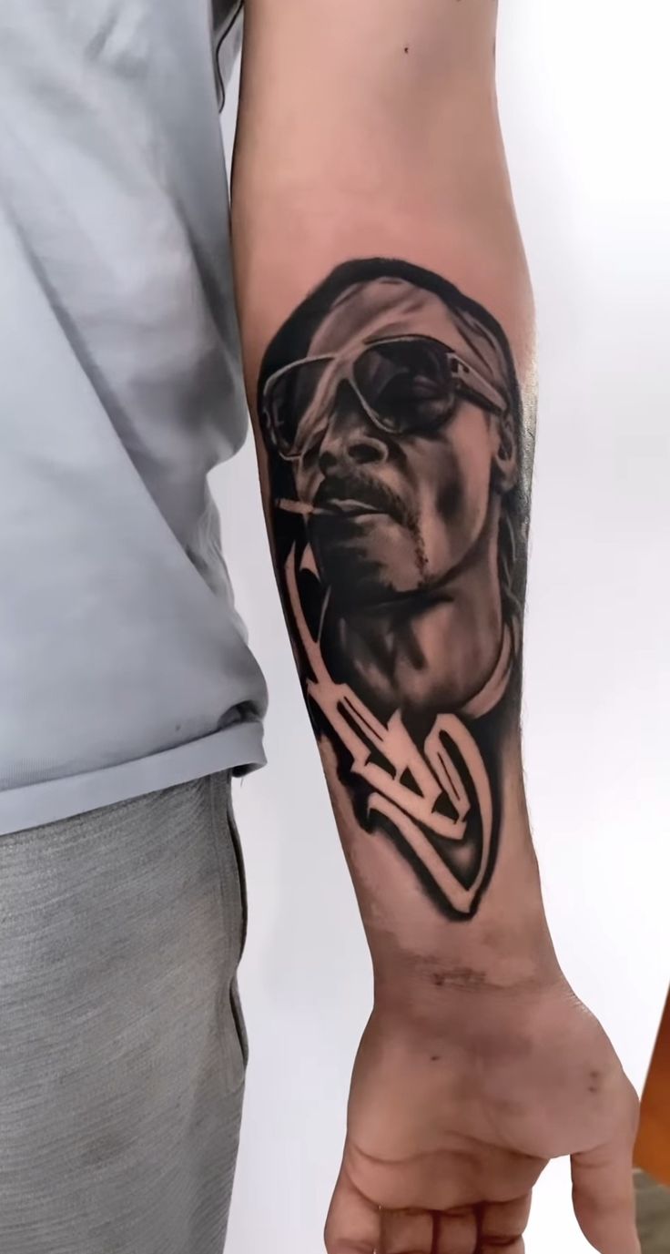 a man with a tattoo on his arm