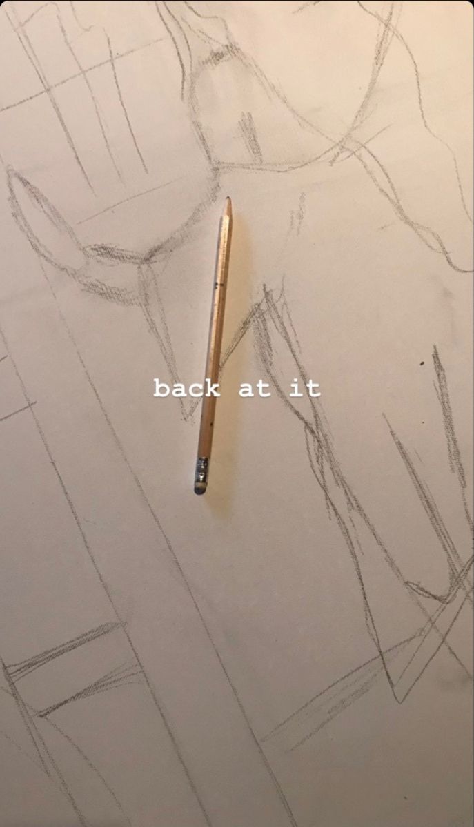 a pencil is laying on top of a drawing paper with the words back at it