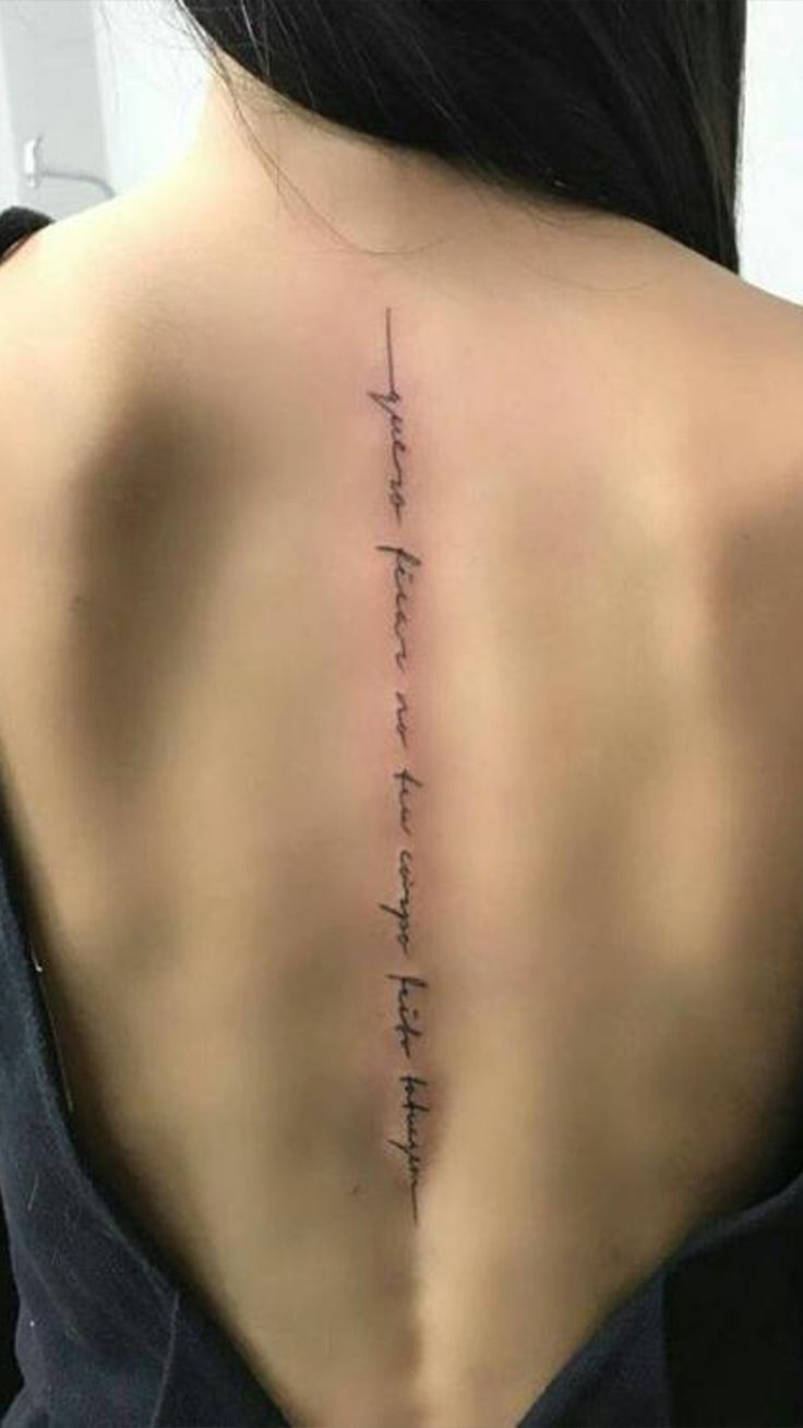 the back of a woman's neck with an inscription on it that reads,