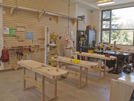 a workbench in a workshop with lots of woodworking tools on the table