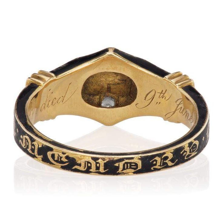 Antique Victorian Mourning Ring Circa 1854 The Maureen Ring is a Victorian Mourning Ring circa 1854! This unique ring centers Peruzzi cut diamond of approximately 0.10 carats and accented by 4 old mine cut cushion diamonds that combine for approximately 0.20 carats. The diamonds are set in a 14kt yellow gold settings that is topped with black enamel. The outside of the rind has old English font that reads "IN MEMORY OF" and the inner shank reads "W.Y. died 9th June 1854". The ring is size 6.5 an Victor Barbone, Old English Font, Cushion Diamond, Yellow Gold Setting, Unique Ring, Antique Victorian, Black Enamel, Unique Rings, Diamond Cuts