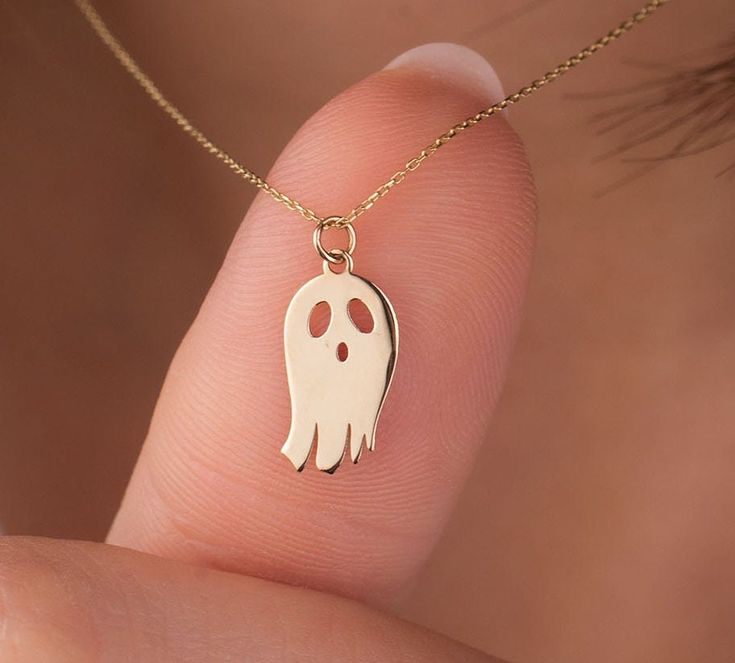 It is one of Onseva's products with the highest customer satisfaction, designed specifically for Halloween and for cute ghost lovers!  Our ghost necklace is 14k solid gold. It belongs to the Onseva Halloween collection. You should not miss any product in this collection, which will be on sale only in limited numbers and for a short time. Everyone from 7 to 70 will love our cute ghost necklace.  This gold Halloween necklace is the perfect gift choice for your loved ones for Halloween or other special occasions like Christmas! 👻 🎁 If you want, you can add a gift note for your loved ones. It arrives in a special jewelry gift box. ✨ We respond to your questions happily. Your question will be answered within 24 hours. Do not hesitate to contact us. 💎 I hope you have a lot of Onseva's designs White Jewelry Gift, Halloween Novelty Necklaces As Gift, White Halloween Necklace Gift, White Necklace For Halloween Gift, Ghost Necklace, Gold Halloween, Pendant Ideas, Halloween Pendant, Halloween Necklace