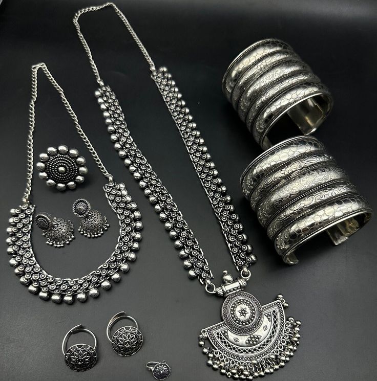 Luxury Oxidized Temple Jewelry, Luxury Oxidized Finish Temple Necklace For Festivals, Silver Temple Jewelry Sets For Festivals, Silver Heavy Sets For Diwali, Navratri Themed Motif Jewelry Gift, Adjustable Silver Jewelry With Motifs, Adjustable Temple Jewelry With Motifs, Traditional Silver Sets As Gift, Traditional Silver Sets For Gifts