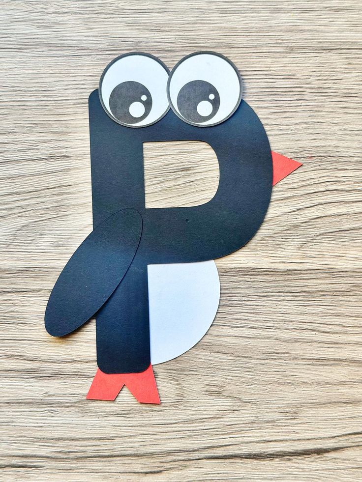 the letter p is made out of paper with eyes