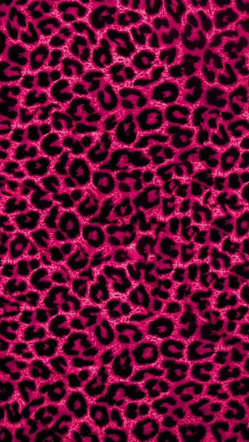 a pink and black animal print fabric with lots of small spots on it's surface