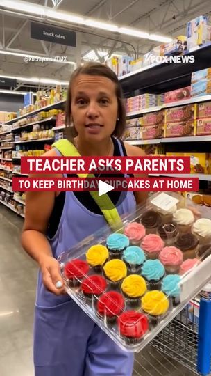 a woman holding a tray of cupcakes in a grocery store with the caption teacher asks parents to keep birthday cakes at home