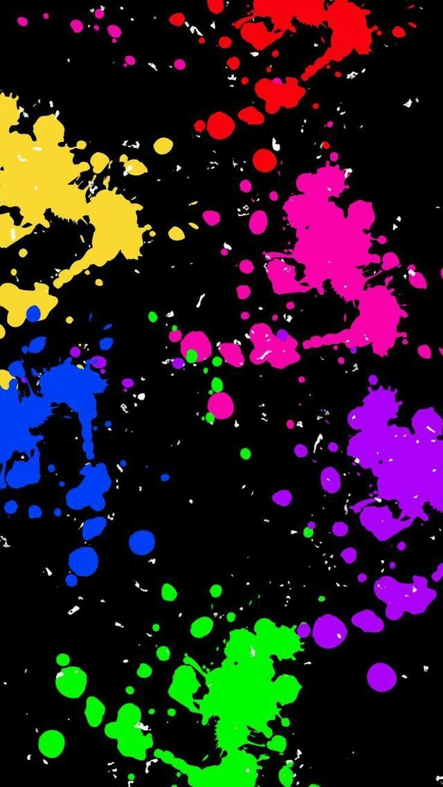 multicolored paint splattered on black background