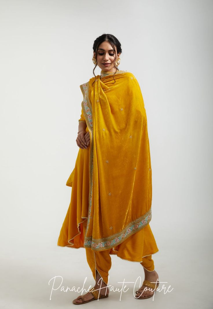 The sunny and cheerful yellow color of the shawl is both bold and refreshing, making it a perfect accessory for both formal and casual occasions. The marodi and resham embroidery on the shawl adds texture and depth, making it an eye-catching accessory that is sure to stand out. Styling Tips: When styling a yellow shawl with marodi and resham embroidery, it's important to balance the bold color and intricate design with simpler pieces. Pair it with neutral colors such as black or white to make the yellow color stand out, or pair it with complementary colors such as blue or green for a bright and cheerful look. Brand : Panache Haute Couture (Made in India) Embroidery: Resham and Marodi Fabric: Silk Velvet Customisation: Colour can be customized as per customers' requirements. Please contact Yellow Silk Thread Traditional Wear For Wedding, Silk Unstitched Yellow Suit For Eid, Yellow Anarkali Unstitched Suit With Sheer Dupatta, Designer Yellow Silk Unstitched Suit, Yellow Raw Silk Unstitched Suit For Eid, Yellow Bollywood Style Silk Unstitched Suit, Yellow Raw Silk Unstitched Suit With Straight Kurta, Eid Yellow Raw Silk Unstitched Suit, Unstitched Yellow Traditional Wear For Eid