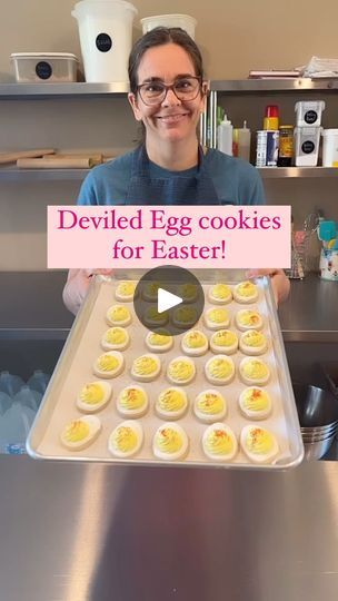 a man holding up a tray of deviled egg cookies