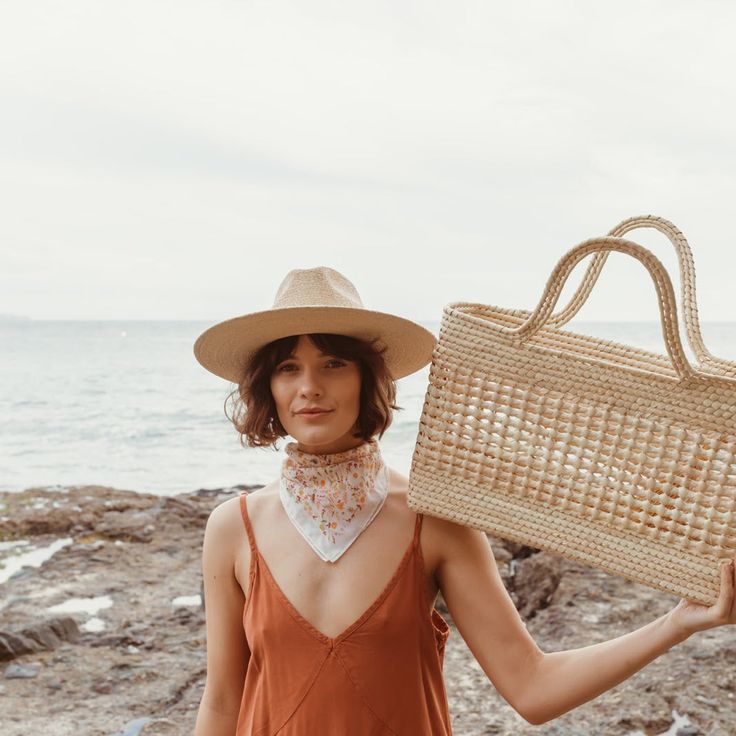 An oversized basket bag, the Mercado features an open weave design bringing neutral tones and texture to your personal style and home décor in all the right ways. The natural palm straw, sustainably sourced by artisans in Guerrero, Mexico, gives a coastal, California-inspired feel to any space. The styling possibilities are endless at home, with the Mercado basket, you can store blankets in the living room, or soft kids' toys in a playroom or nursery. With large, sturdy handles for hand-carrying Natural Basket Straw Bag For Market, Casual Woven Bucket Straw Hat, Neutral Straw Bag For Beach Vacation, Casual Summer Straw Bucket Hat, Palm Leaf Straw Tote Bag For Market, Neutral Beach Bag For Summer, Natural Toquilla Straw Hat For Picnic, Chic Rectangular Straw Bag For Market, Neutral Woven Straw Bag For The Beach