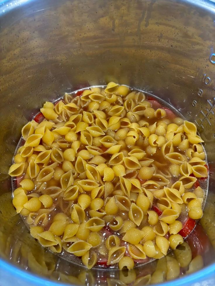 a bowl filled with pasta and sauce on top of a table