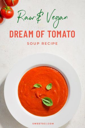 a bowl of tomato soup with basil leaves on top and the words, raw & vegan dream of tomato soup recipe