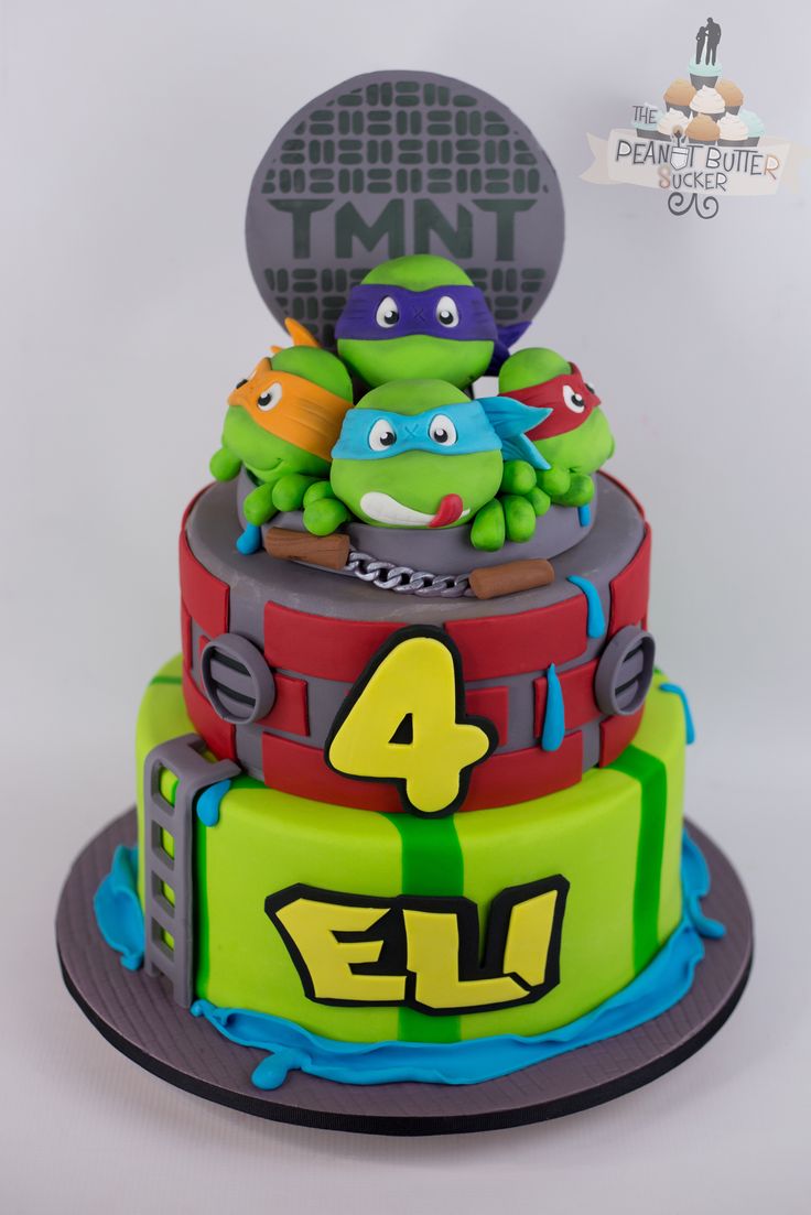 a three tiered cake with teenage mutant characters on it's top and the number four