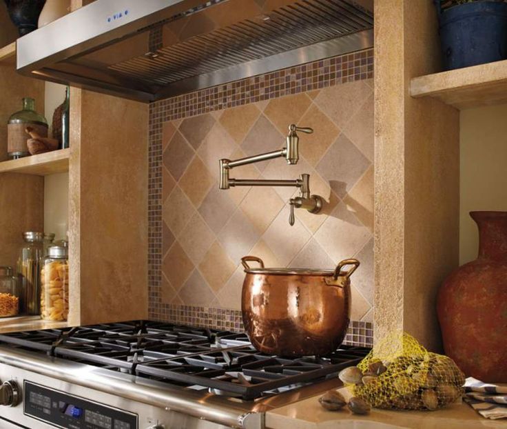 a kitchen stove with a pot on the burner