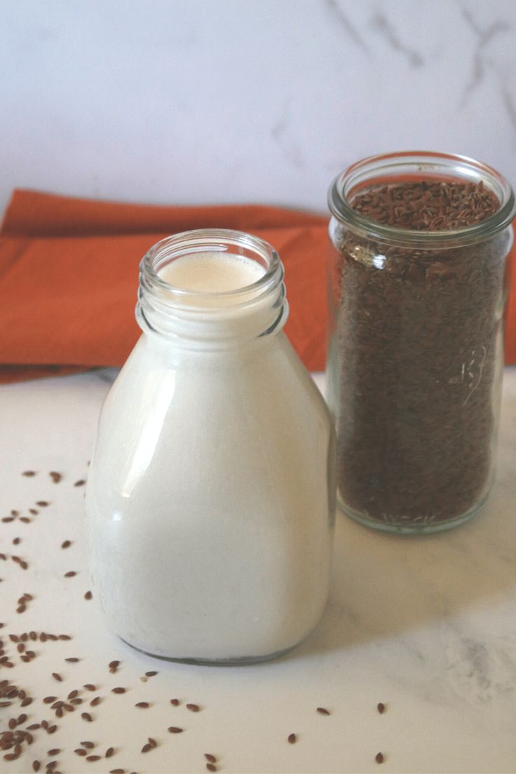 two jars filled with different types of food