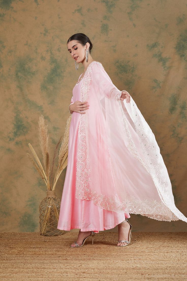 The baby pink embroidered anarkali set features exquisite thread and mirror embroidery on its neckline and sleeves with cutwork details. The anarkali comes with a beautiful flair and is paired with a baby pink embroidered silk organza dupatta. Pink Organza Anarkali Set With Chikankari Embroidery, Pink Chanderi Anarkali Set With Dabka Work, Pink Organza Kurta With Sheer Dupatta, Pink Organza Anarkali Set With Dupatta, Pink Anarkali Organza Dupatta, Pink Unstitched Anarkali Set With Sheer Dupatta, Pink Organza Churidar With Traditional Drape, Designer Pink Organza Churidar, Semi-stitched Pink Anarkali Set With Sheer Dupatta