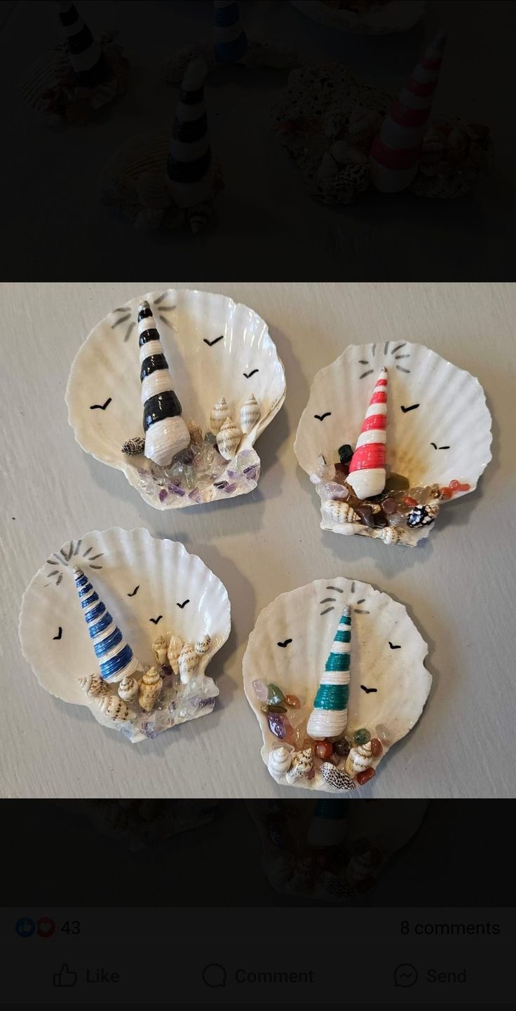 three small paper plates with lighthouses on them