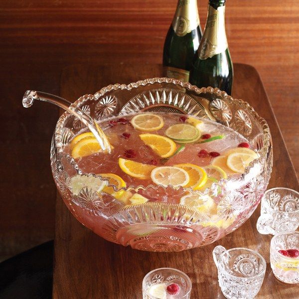 a large glass bowl filled with fruit and ice