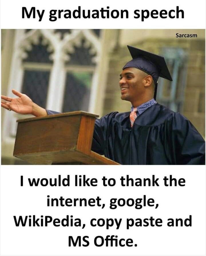 a man in graduation cap and gown standing at a podium with his hand out to someone