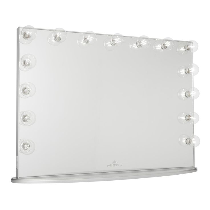 a large mirror with lights on top of it