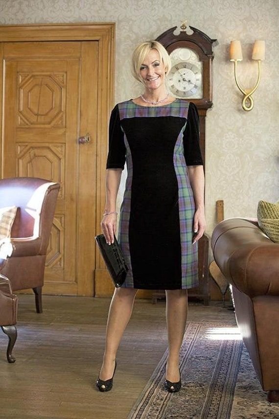 Kerry Campbell is a quirky and flattering 3/4 sleeved and knee-length navy velvet dress with wide tartan panels that flair out. It has a high round neck that is trimmed in matching tartan giving it a sophisticated finish. This dress comes in two lengths, one just over the knee and one length just above it. Shoulder to hem short dress: 95cm/37.4in*  Shoulder to hem long dress: 100cm/39.3in* Due to the delicacy of the tartan fabric, we recommend that garments should be dry cleaned only. * Can vary slightly. If you require a certain length please contact us to discuss. Older Women Dresses, Dresses With Tennis Shoes, Navy Velvet Dress, Transgender Outfits, Women Appreciation, Cute Skirt Outfits, Older Women Fashion, Bridesmaid Shirts, Tartan Fabric