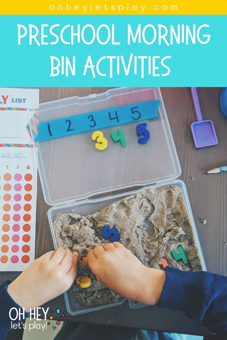 a child playing with numbers and letters in a plastic container that is filled with magnets