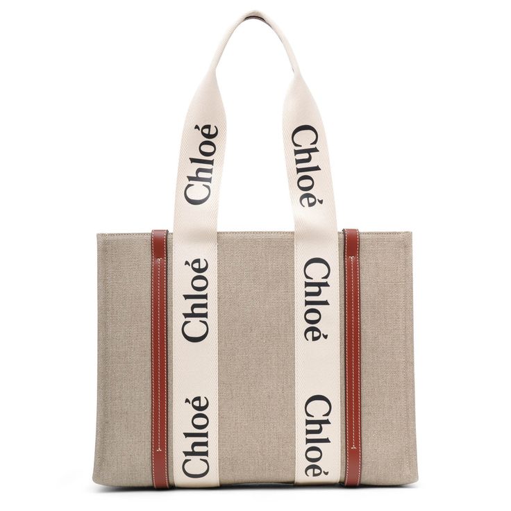 White and brown linen canvas tote bag from Chloé. The Medium Woody bag is made of linen canvas detailed with contrasting vertical leather strips, along with the signature Chloé logo ribbon. It is complete with a main compartment designed to fit your mobile phone.Measurements: L37 x H26 x W12 cm Made in Italy Chloe Logo, Linen Canvas, Brown Canvas, Canvas Tote Bag, Canvas Bag, Canvas Tote, Mobile Phone, Ribbon, Italy