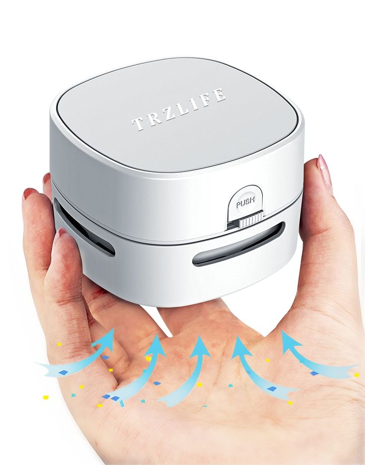 a person's hand holding a frizbee projector