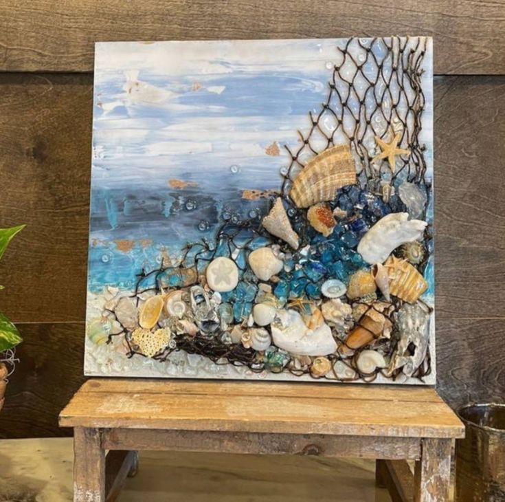 a painting is displayed on a wooden bench