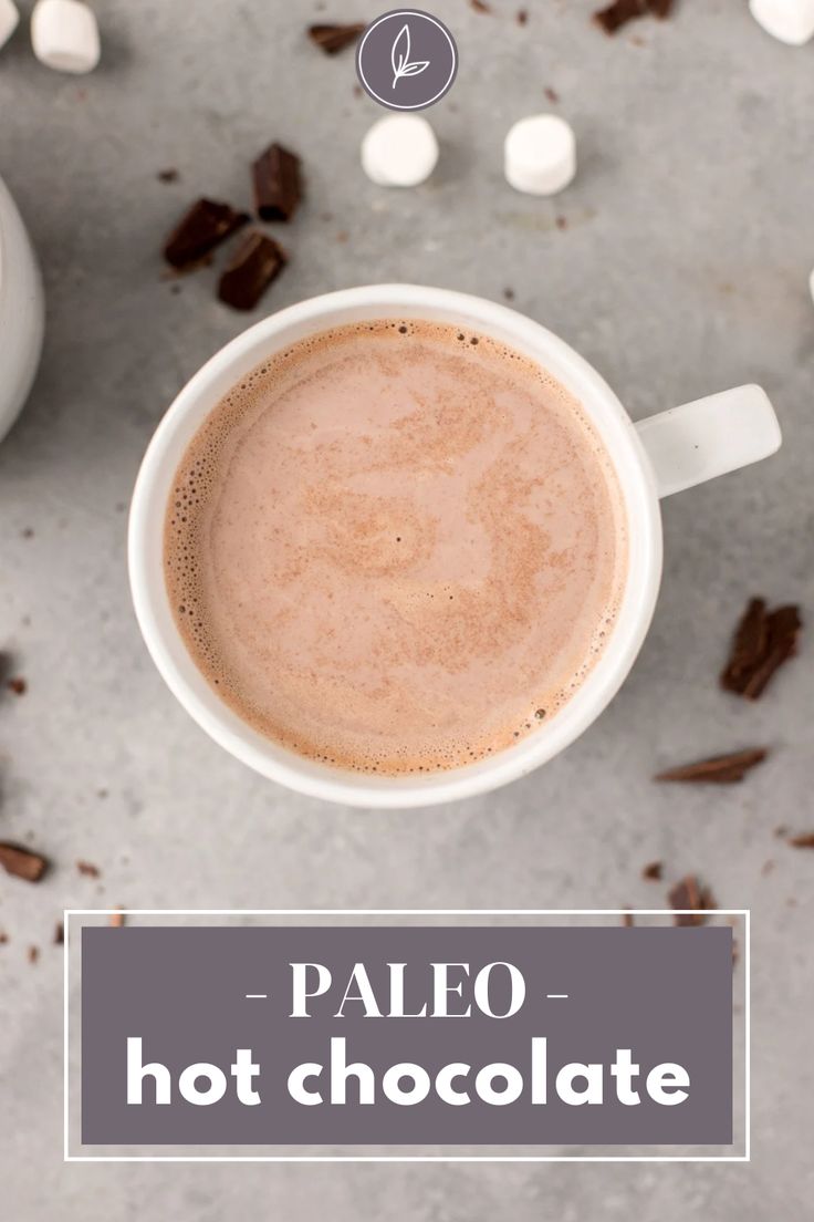 a cup of hot chocolate with marshmallows around it and the words paleo - hot chocolate