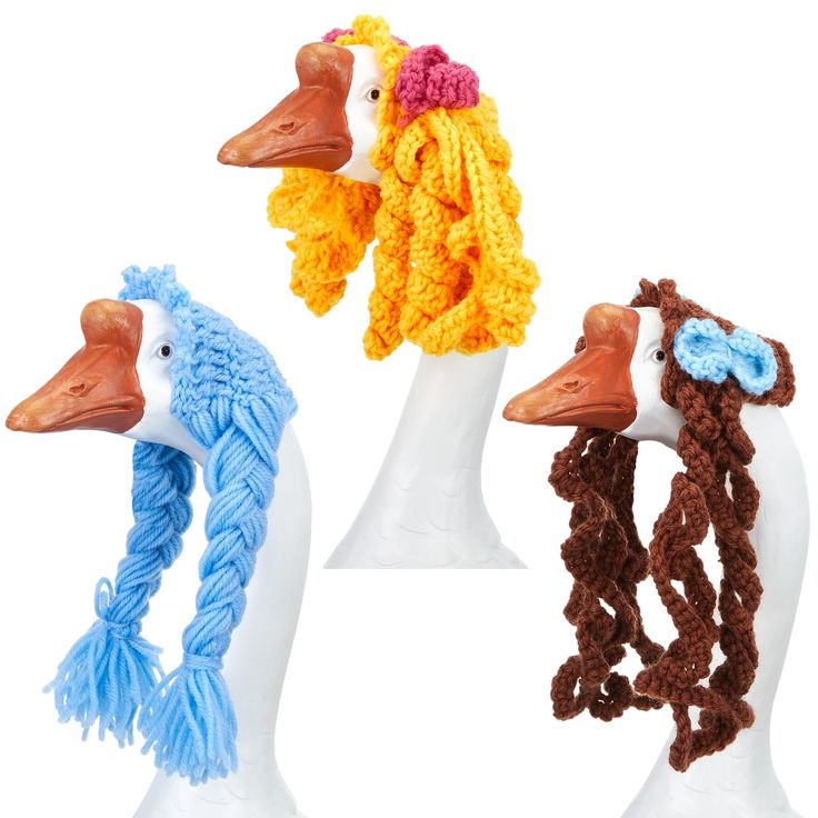 three crocheted ducks wearing hats and scarves on their heads, one with a scarf around it's neck