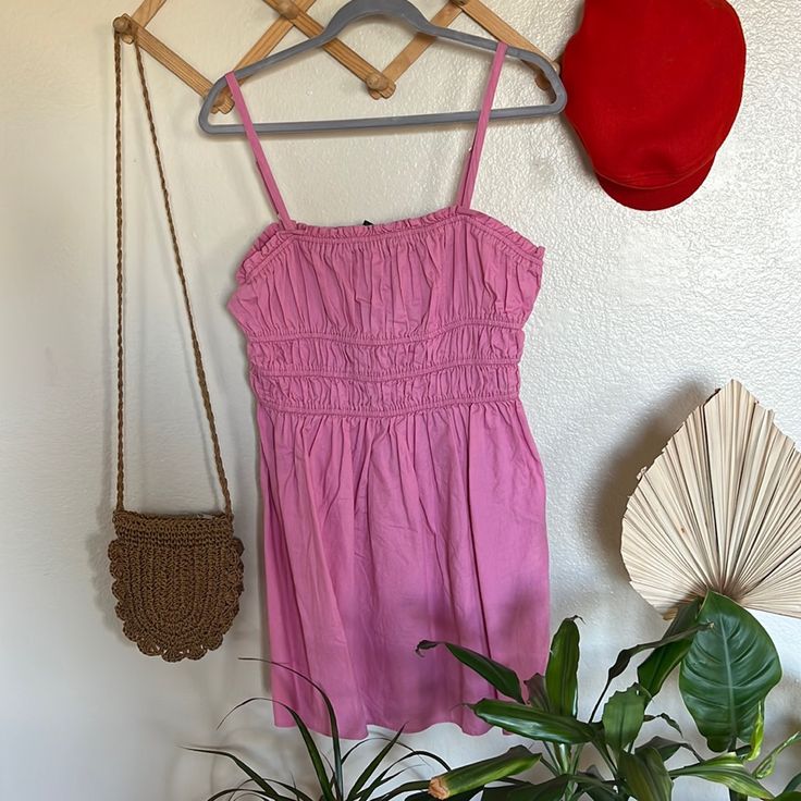 Pink Spaghetti Strap Dress With Adjustable Straps Pink Sundress With Adjustable Straps For Day Out, Pink Cotton Sundress With Adjustable Straps, Casual Pink Dresses With Adjustable Straps, Pink Cotton Dress With Adjustable Straps, Cotton Sundress With Smocked Bodice For Day Out, Casual Cotton Sundress With Spaghetti Straps, Pink Cami Mini Dress For Beach, Pink Cami Mini Dress For The Beach, Spring Pink Cami Mini Dress