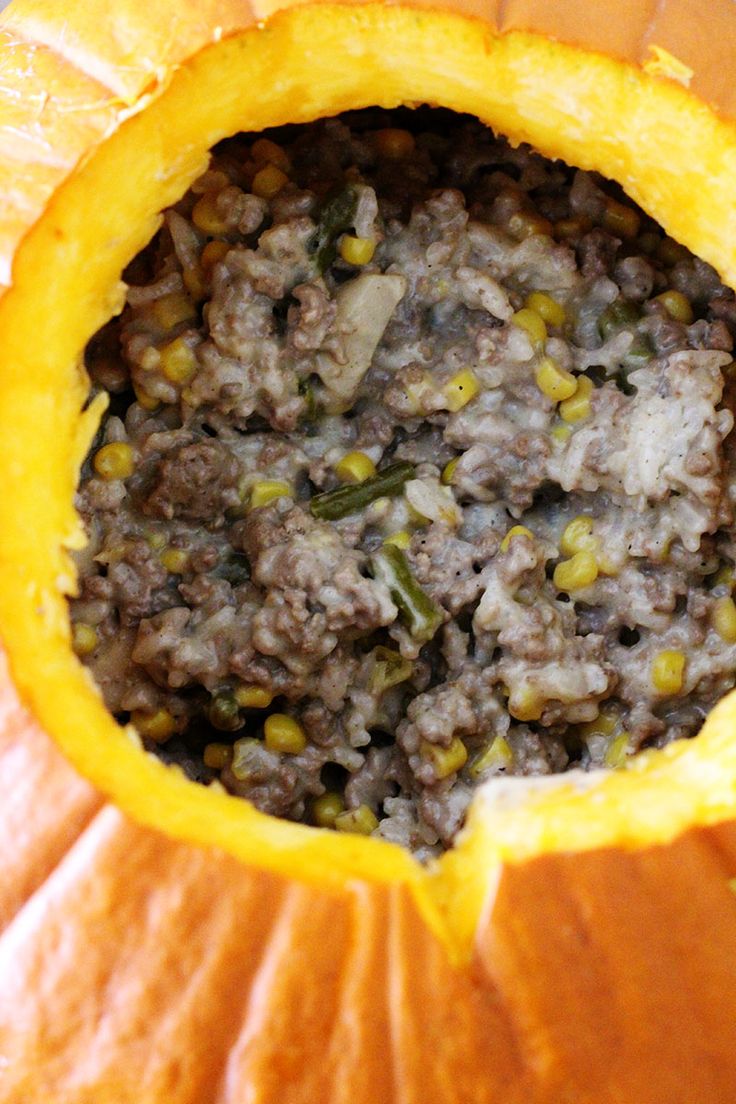 the inside of a pumpkin is filled with food