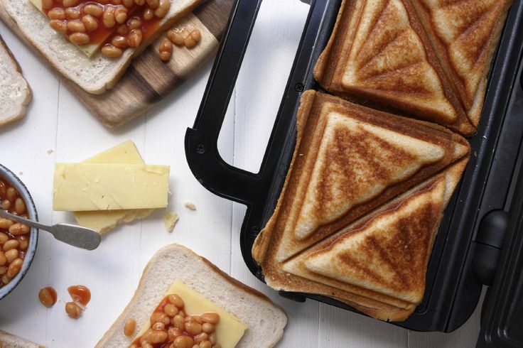 toasted sandwiches with beans and cheese on them