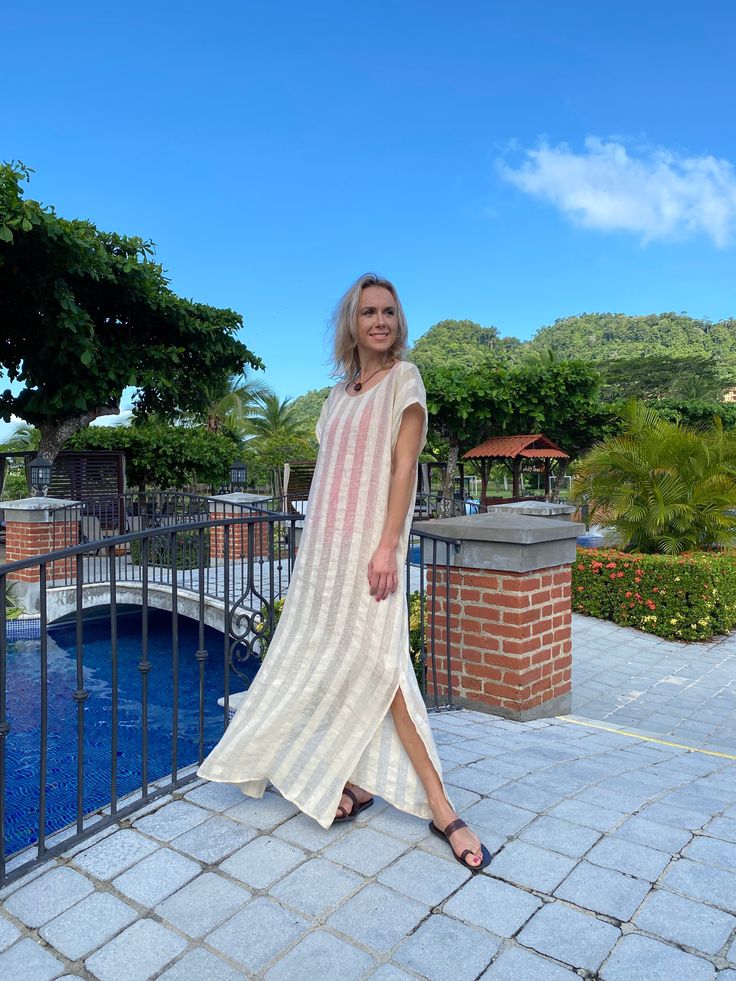 Whether you will wear it as an over-bikini cover-up, or as a dress on its own, you will be able to achieve an elevated look with our Collette Kaftan. Delicate and sophisticated, this linen kaftan will be a perfect fit at a resort by the sea, or at any poolside setting. You can also wear it as a tunic over a slip dress, shorts and even jeans. Collette Kaftan is one size. Due to its breathable transparency, you can purchase it together with our Leah cotton slip dress, that is available in sizes S, Beige V-neck Linen Dress For Beach, Long Vacation Dress With Side Slits, Long Dresses With Side Slits For Vacation, Beige Beachwear Kaftan For The Beach, Beachwear Maxi Dress With Side Slits For Beach Cover-up, Beige Kaftan For Beach Cover-up, Beige Beachwear Kaftan For Vacation, Chic V-neck Linen Dress For Beach, Beach Season Beige Vacation Kaftan