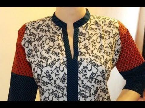 a mannequin is wearing a shirt with an intricate design on it's collar