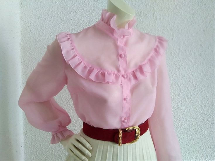 Vintage from the 1960s Materials: ruffled pink blouse 60s TRU sheer blouse, ruffled plastron blouse, pink delicate blouse, romantic feminine blouse, 40 size, bishop sleeve blouse, see through blouse, polyester fabric. Measurements lying flat : shoulders:36 cm (14 inches) bust:45 cm (17,5 inches) waist:42 cm (16,5 inches) total length :55 cm (21,5 inches) sleeve length :65 cm (25, 5inches) Feminine Collared Blouse With Ruffles, Feminine Collared Blouse For Party, Chic Pink Blouse With Ruffled Collar, Pink Ruffled Tops For Formal Occasions, Formal Pink Ruffled Top, Formal Pink Blouse With Ruffles, Pink Ruffled Collared Blouse, Feminine Blouse For Vintage Fashion, Feminine Vintage Fashion Blouse