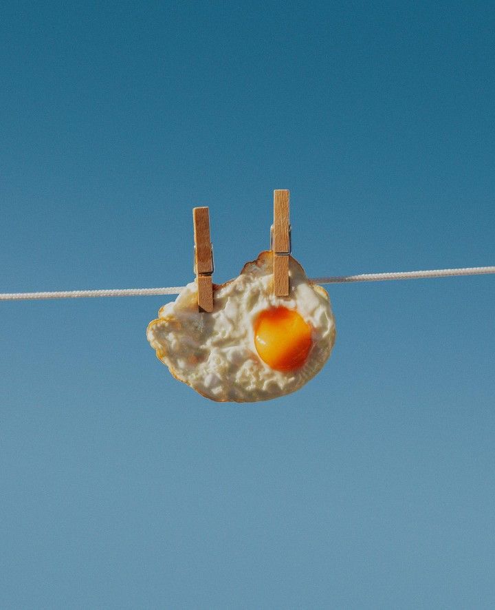 an egg yolk hangs on a clothes line