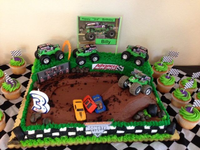 a birthday cake with cupcakes in the shape of trucks and cars on it