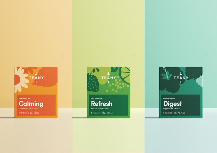 three different flavors of tea sitting on top of each other in front of a multicolored wall