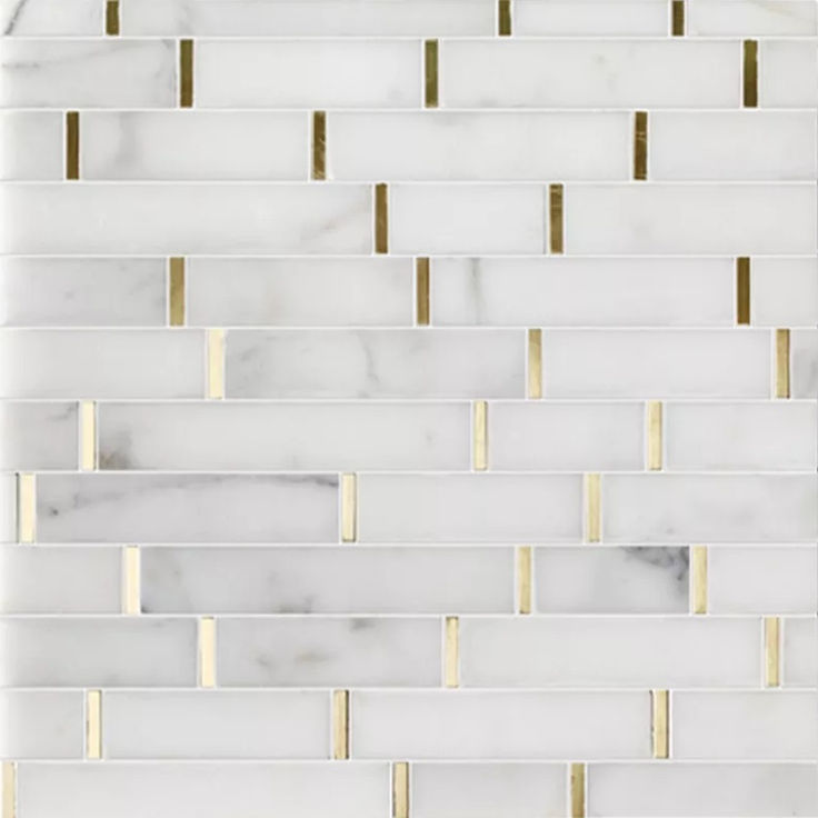 white and gold marble mosaic tile with metallic strips on the edges, in an angled pattern