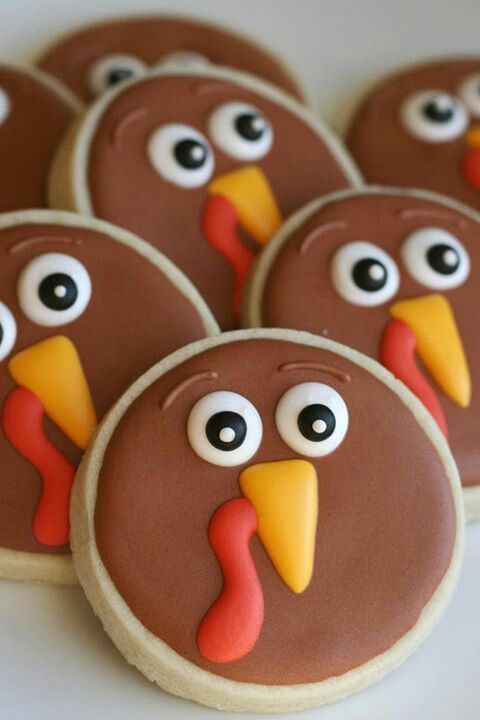 cookies decorated to look like turkeys with googly eyes