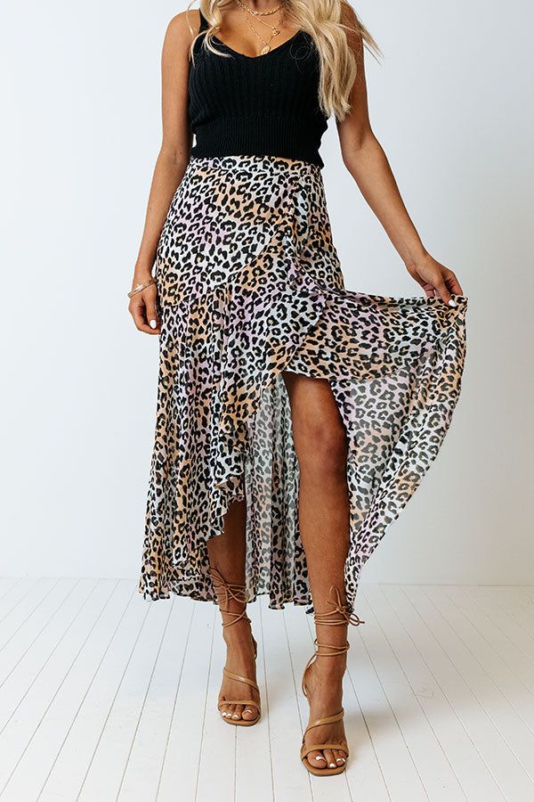 There is no better piece to make an outfit with than our pretty peach colored 'Only Sunshine' skirt featuring lightweight breezy material patterned with a black leopard print print, a high waistline, and a relaxed silhouette that falls into a high/low tulip hemline!                                         Measurements XS variant has  a Hip of 32",  a Length of 36",  a Slip Length of 16.5",  a Waist of 24".  S variant has  a Hip of 34",  a Length of 36.5",  a Slip Length of 17",  a Waist of 26". Leopard Print Long Skirt For Spring, Long Leopard Print Skirt For Spring, Spring Leopard Print Midi Skirt, Chic Leopard Print Skirt For Spring, Leopard Print Flowy Long Skirt, Long Flowy Leopard Print Skirt, Flowy Long Leopard Print Skirt, Trendy Leopard Print Summer Skirt, Flowy Leopard Print Skirt For Spring