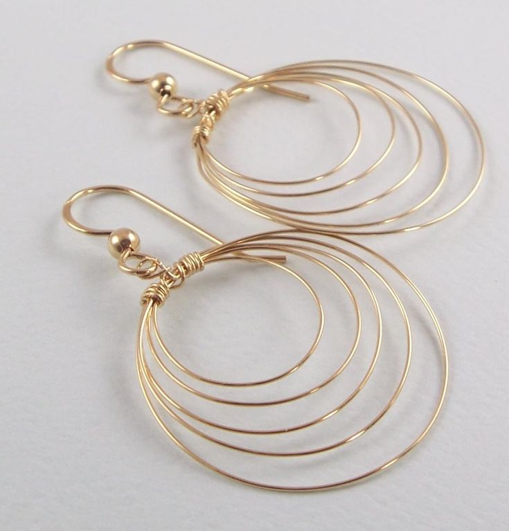 Goldfilled wire used to make this earring.  Earring length is 1 3/4 inches. Largest hoop diameter is 1 inch.  Also available in sterling silver and clip on style. Modern Wire Wrapped Round Hoop Earrings, Modern Wire-wrapped Round Hoop Earrings, Minimalist Wire Wrapped Round Hoop Earrings, Minimalist Wire Wrapped Hoop Earrings, Sterling Silver Wire Wrapped Hoop Earrings, Wire Wrapped Hoop Jewelry, Modern Wire Wrapped Hoop Earrings, Everyday Wire Wrapped Hoop Earrings, Modern Wire Wrapped Hoop Jewelry