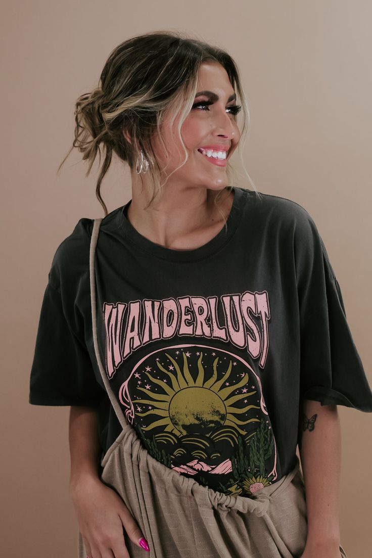 Embark on a style journey with the Wanderlust Sun Graphic Tee in Charcoal. This tee exudes a sense of adventure with its wanderlust-inspired sun graphic, adding a touch of free-spirited charm to your casual look. Graphic Tee Full length Oversized fit Pink/Yellow/Green 100% cotton Imported Model Specs: Emily is wearing a size small in the photo.How will this item fit you? Check out our MODEL SPECS (Typical Sizing - Karli: S-Size 5/26 - 5ft 2in, Emily: S-Size 3/25 - 5ft 5in, Syd: L/XL- Size 15/ - Trendy Relaxed Fit T-shirt For Outdoor, Trendy Outdoor Relaxed Fit T-shirt, Trendy Outdoor Graphic Print T-shirt, Summer Graphic Tee With Moon Print, Relaxed Fit T-shirt For Summer Adventure, Relaxed Fit Moon Print Graphic Tee, Black Graphic Tee With Moon Print, Cotton Graphic Tee With Moon Print, Celestial Graphic Tee