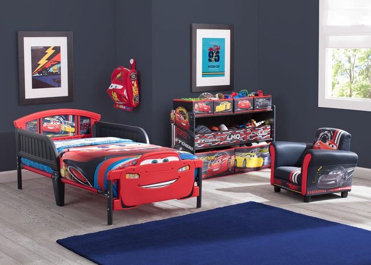 a bedroom with cars beds and furniture in it