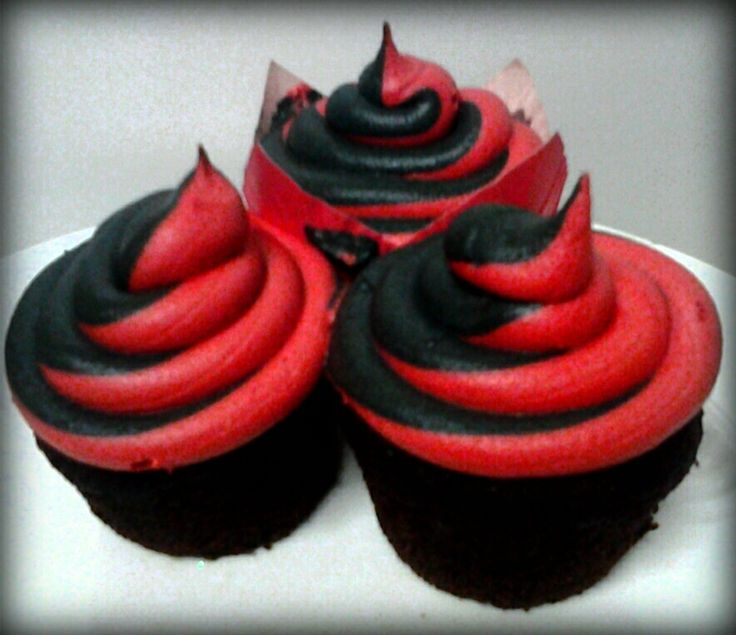 three cupcakes with red and black frosting